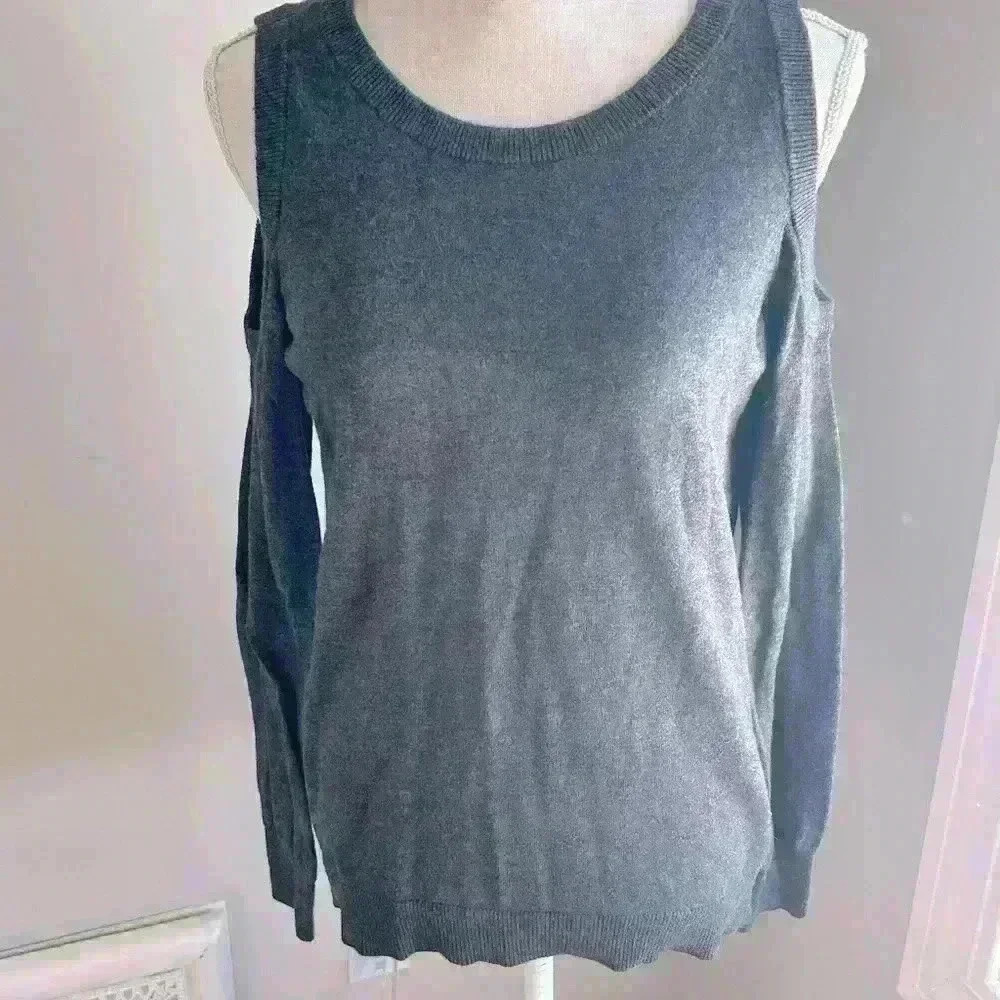 Woman’s large gray sweater top